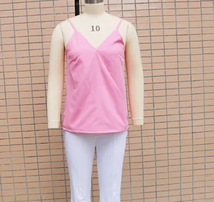 Detailed view of a pink loose-fitting V-neck camisole tank top on a studio mannequin