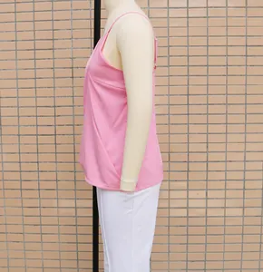 Side view of a pink sleeveless loose casual V-neck camisole top on a mannequin