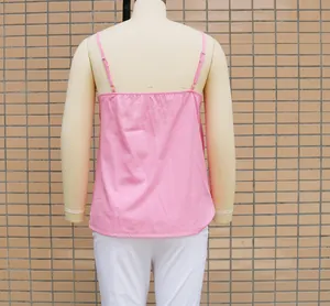 Back view of a pink sleeveless camisole top with adjustable straps on a mannequin.