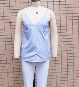 Detailed view of a light blue V-neck spaghetti strap camisole on a fashion mannequin