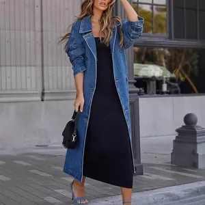Modern women's long denim trench coat featuring a button-down design and loose fit style