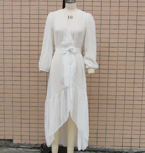 Front view of white chiffon long-sleeved vacation dress on a mannequin