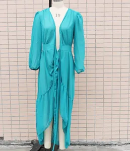 Detailed view of a sheer teal chiffon beach cover-up dress displayed on a mannequin