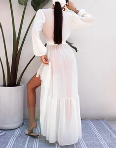 Detailed rear view of a long white sheer chiffon beach cover-up dress for summer vacation