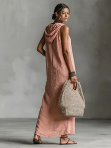 Detail of pink sleeveless hooded maxi dress with linen texture and floor-length design