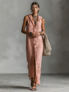 Full view of a sleeveless hooded button-down long dress in light pink linen fabric.