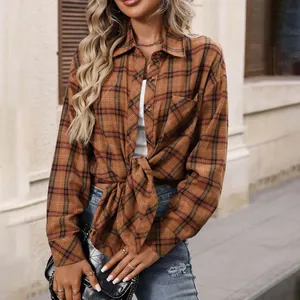 Close-up of vintage brown plaid long-sleeved shirt for women with waist-tie detail