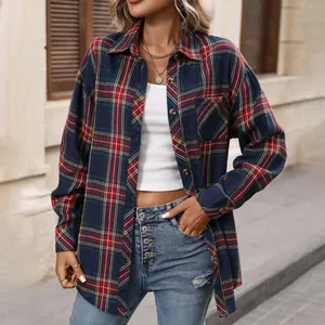 Close-up detail of vintage navy blue and red plaid long sleeve shirt for women