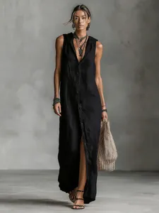 Detail view of a black sleeveless hooded maxi dress with front button closure.