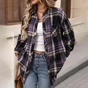 Detailed view of a vintage purple and black plaid long sleeve shirt worn by a model