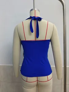 Rear view detail of a vibrant royal blue halter neck backless top on a beige mannequin
