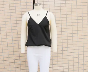 Detail view of a black V-neck spaghetti strap camisole on a professional mannequin