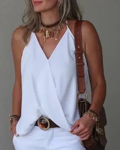 Chic white V-neck sleeveless top styled with accessories for a casual summer look