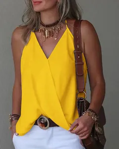 Close-up of vibrant yellow V-neck sleeveless wrap top for women in casual summer style.