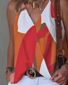 Close-up detail of women's casual V-neck tank top featuring vibrant abstract geometric print