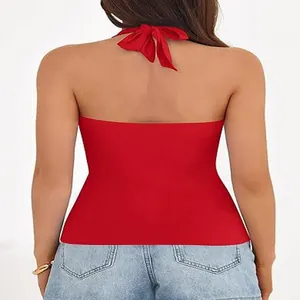 Back view of elegant red halter neck sleeveless top featuring a stylish bow tie closure