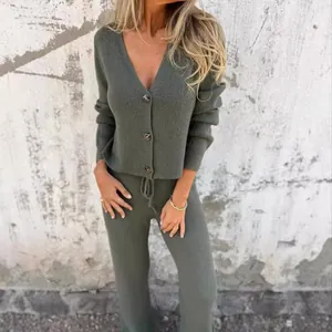 Two-piece ribbed knit lounge set featuring button-up cardigan and drawstring trousers