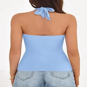 Back view of a solid light blue halter neck top featuring a stylish bow-tied strap detail
