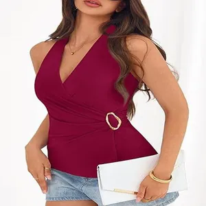 Close-up of sleeveless burgundy V-neck wrap top with decorative gold ring detail