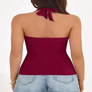 Detailed back view of a maroon backless halter top featuring a stylish bow tie at the neck