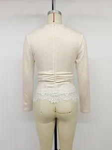 Detailed back view of beige slim fit knitted top with lace trim and hidden zipper