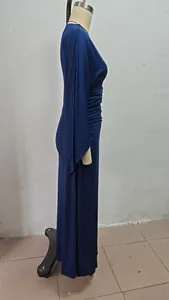 Side profile view of a navy blue elegant long-sleeved evening gown on a dress form mannequin.