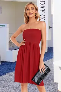 Full detail shot of a vibrant red strapless smocked tube top dress for summer fashion