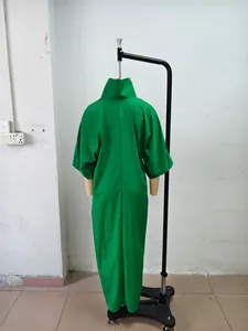 Back view of a loose green mid-sleeve maxi dress on a mannequin in a studio setting.