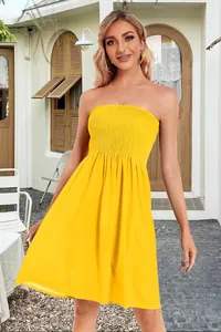 Detailed view of a vibrant yellow strapless smocked bodice tube dress for women