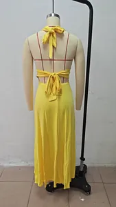 Back view detail showing the elegant bow tie closure of a yellow halter maxi dress