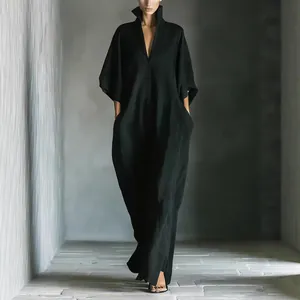 Elegant minimalist black V-neck maxi dress with loose fit and mid-sleeves.