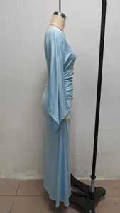 Side profile of a light blue slim-fit maxi dress with elegant long sleeves on stand.