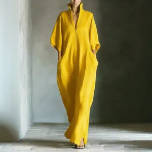 Elegant yellow V-neck maxi dress with mid-sleeves and loose minimalist silhouette.