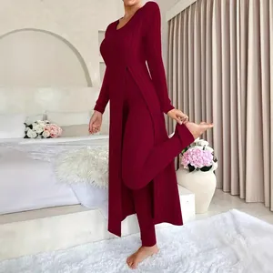 Elegant burgundy ribbed two-piece set with side slit long top and matching leggings