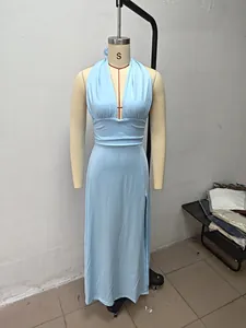 A light blue halter neck V-neck maxi dress with a side slit shown on a mannequin