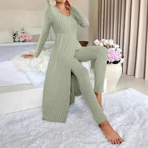 Elegant sage green ribbed two-piece lounge set with split-hem tunic and matching leggings