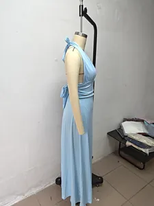Side profile detail of a light blue halter neck backless maxi dress on mannequin