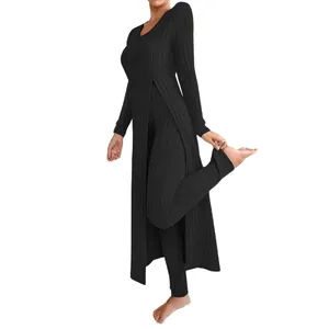 Chic black ribbed two-piece set with round neck and high side slit long sleeve tunic