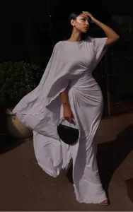 Elegant white slim-fit luxury evening dress with flowing cape sleeves detail view