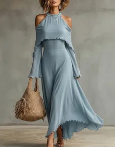 Detail view of light blue off-shoulder dress with ruffled sleeves for summer resort