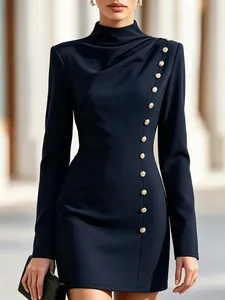 Detailed view of navy blue high-neck dress with decorative gold buttons and draping
