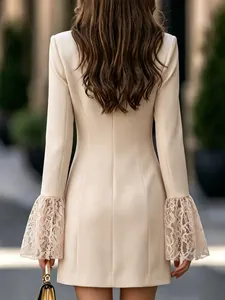 Back view of elegant slim fit beige dress featuring detailed lace bell sleeves