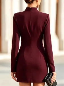 Detail of burgundy bodycon mini dress with back zipper and high neck.