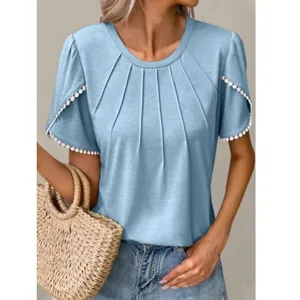 Women's light blue crew neck T-shirt with tulip sleeves and tassel trim details.