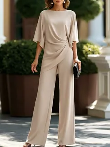 Elegant beige two-piece set featuring a draped waist top and matching wide leg pants
