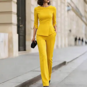 Elegant bright yellow two-piece professional suit with slim-fit top and trousers.