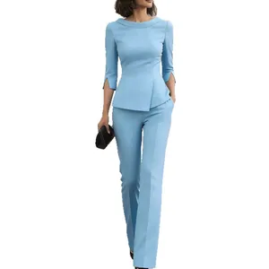 Elegant light blue women's two-piece business suit with peplum top and trousers.