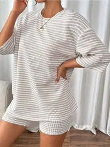 Detailed view of women's ribbed knit striped 2-piece set with oversized top and shorts