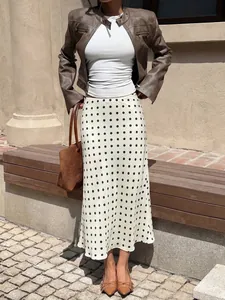 Elegant high-waist white midi skirt with black polka dots for women's autumn style