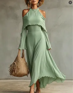 Elegant sage green cold-shoulder maxi dress with ruffle detailing for summer vacation.